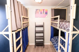 shared-dorm-room-with-bunk-beds-and-privacy-curtains-at-california-dreams-hostel-ocean-beach